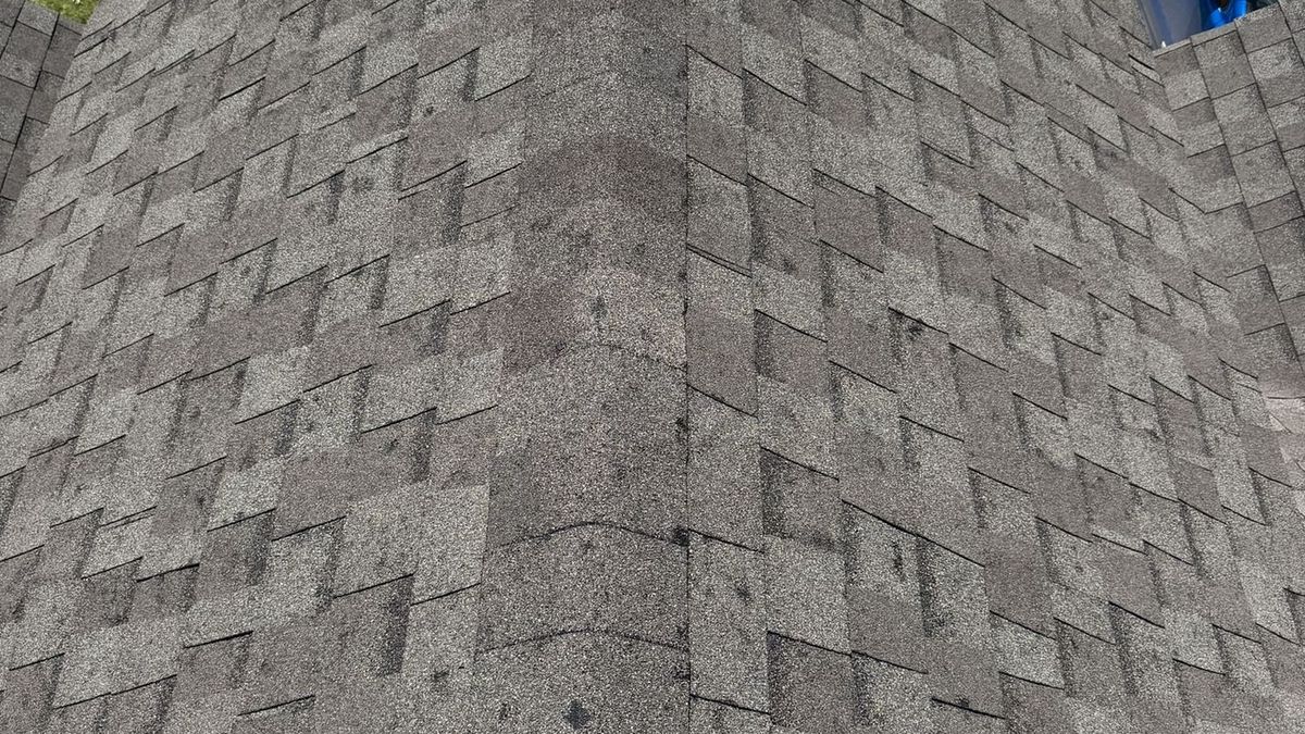 Aerial view of a DFW residential roof showing widespread hail damage