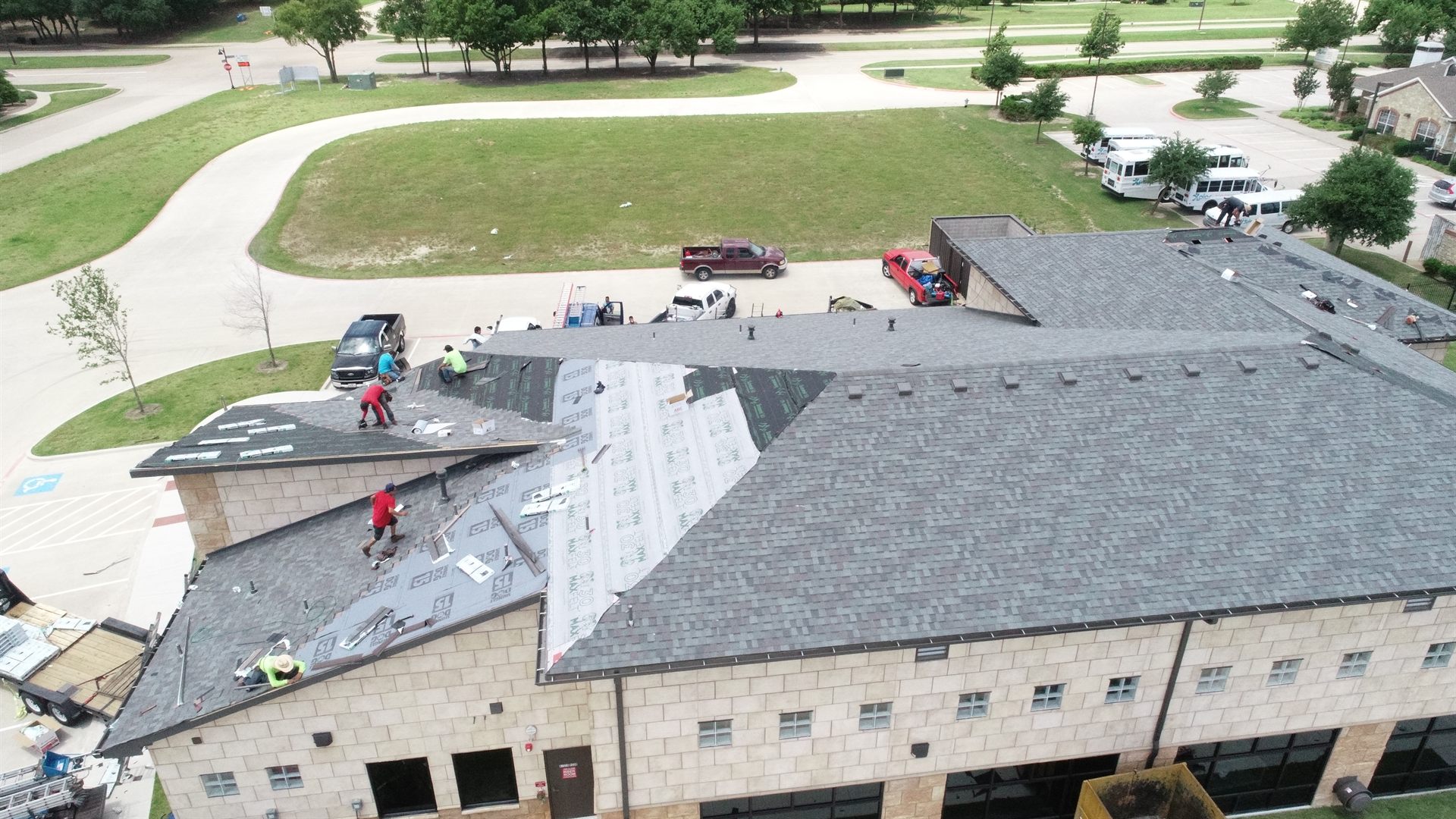 A professional Top Hat Roofing crew working on a residential roof in DFW
