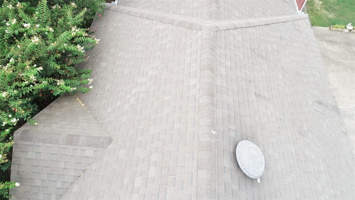 Aerial close-up of a newly installed architectural shingle roof and ridge in Richardson