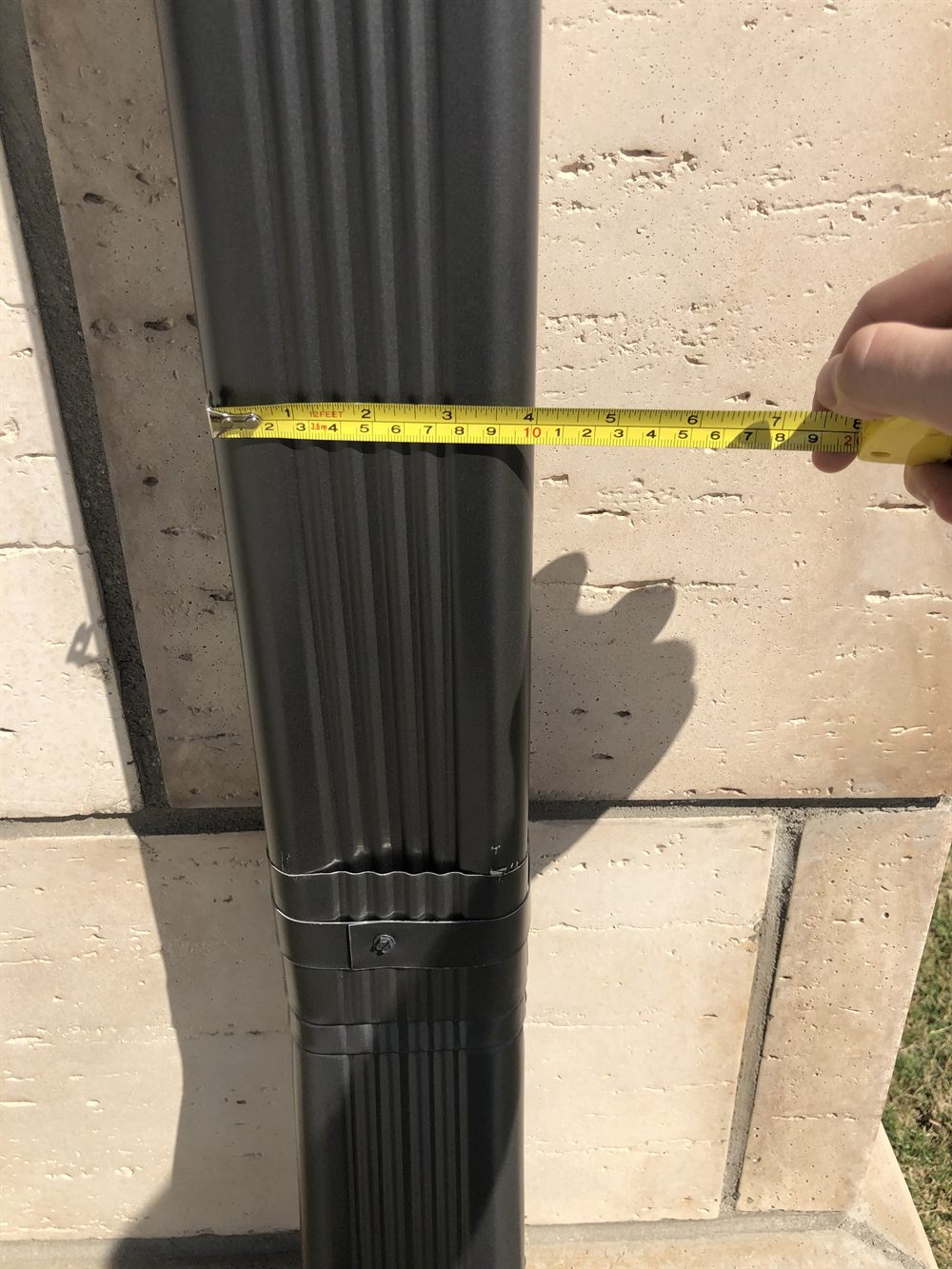 Close-up of a gutter on a DFW home — one of the easiest places to spot roof damage from the ground